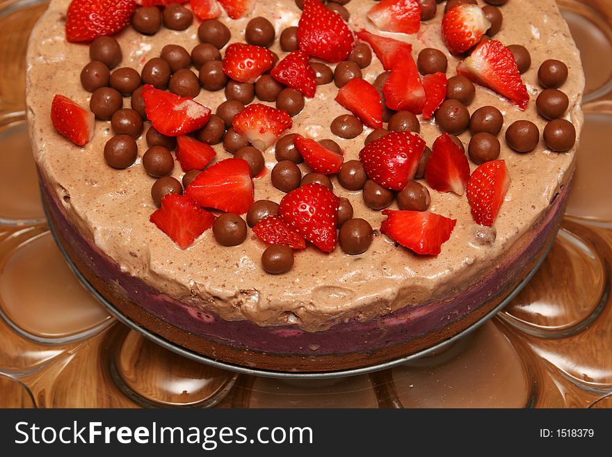 Strawberry icecake on a cakeplatter cropped shot. Strawberry icecake on a cakeplatter cropped shot