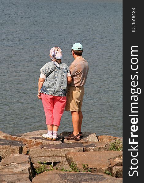 Middle Aged Couple Looking Out Into Ocean