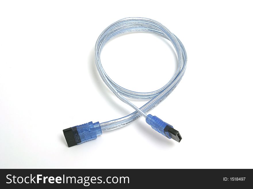 Computer wire with blue ends placed on the white backdrop. Computer wire with blue ends placed on the white backdrop