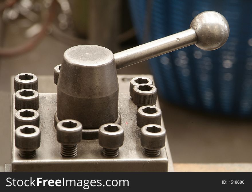 Steel handle on industrial equipment. Shallow depth of field.