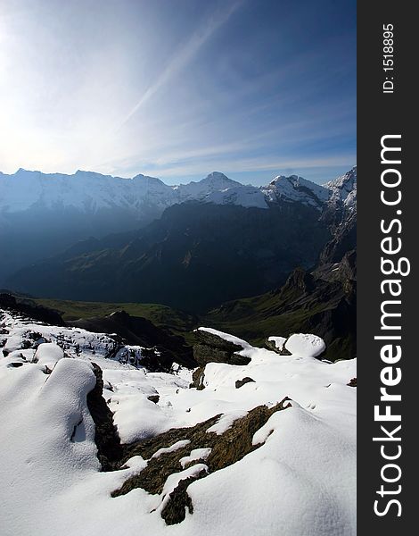 Sunrise over snow covered mountains in the Alps in Switzerland. Sunrise over snow covered mountains in the Alps in Switzerland.