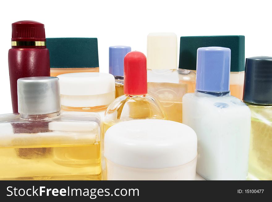 Small shampoo plastic bottles close up on white. Small shampoo plastic bottles close up on white