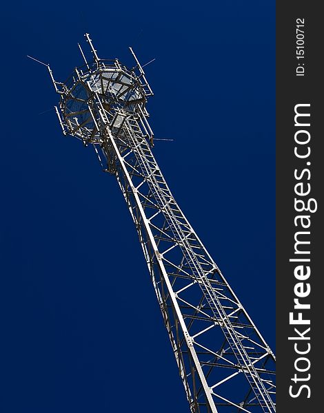 Telecommunication tower without any antennas over dark blue sky. Telecommunication tower without any antennas over dark blue sky.