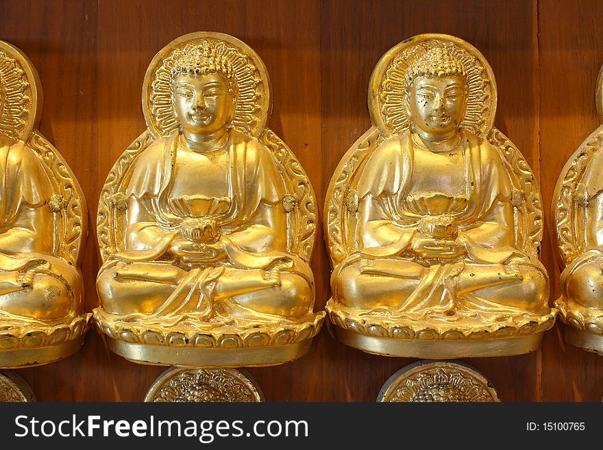 Gold buddha doll