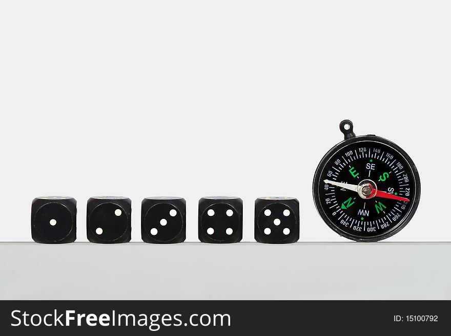 Dice and compass on a white background
