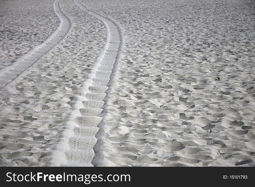 Tire tracks in sand on the beach. Tire tracks in sand on the beach