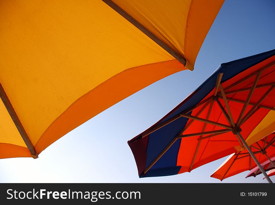 Colorful beach umbrellas against sunlight. Colorful beach umbrellas against sunlight
