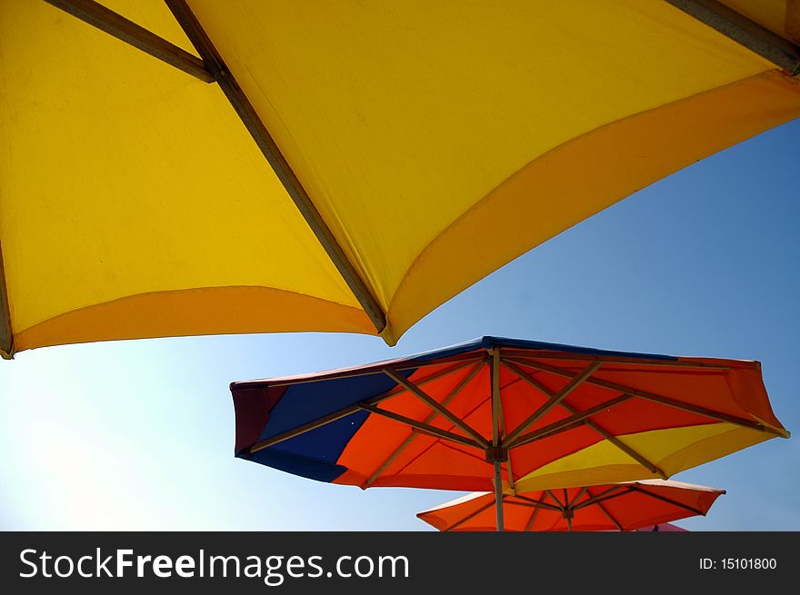 Colorful beach umbrellas against sunlight. Colorful beach umbrellas against sunlight