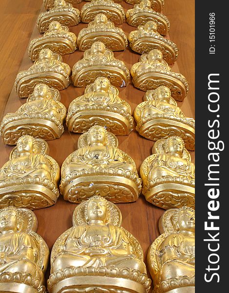 Pattern Of Gold Buddha Doll