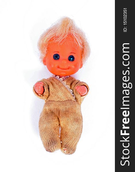 Vintage well-worn baby doll toy on white background. Vintage well-worn baby doll toy on white background