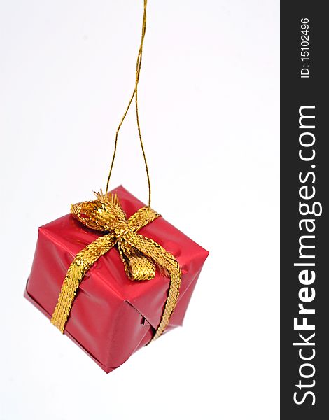 Single Christmas ornament shaped like a present. Single Christmas ornament shaped like a present