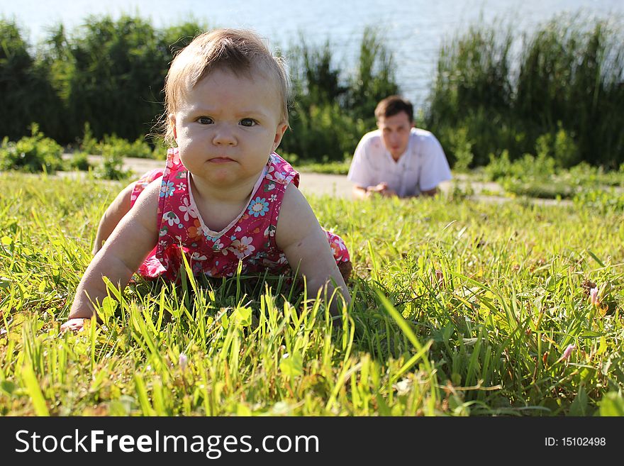 Child with his father at the lake