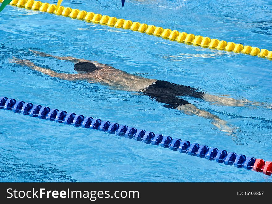 Swimmers in a pool during a contest. Swimmers in a pool during a contest