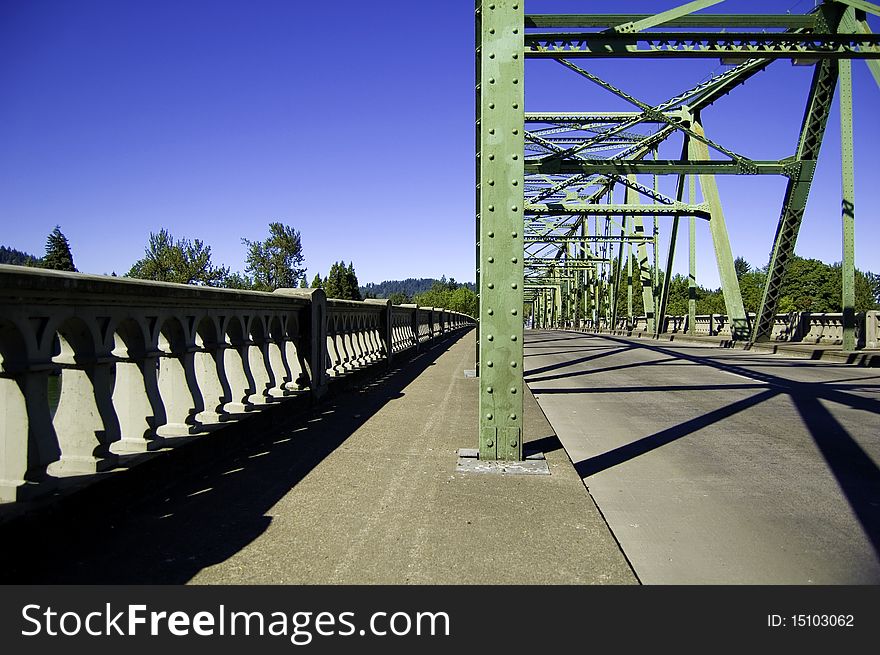 Perspective view of an old green bridge. Perspective view of an old green bridge
