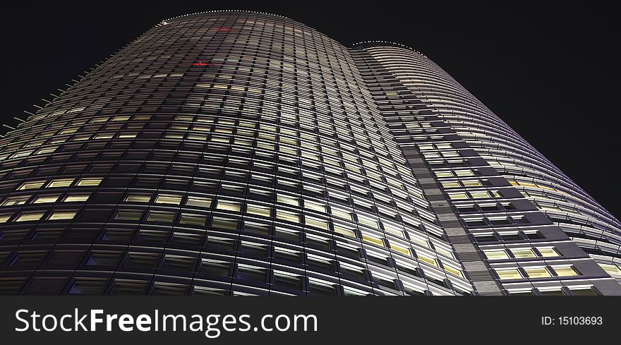 Small part of facade of skyscraper in Tokyo at night