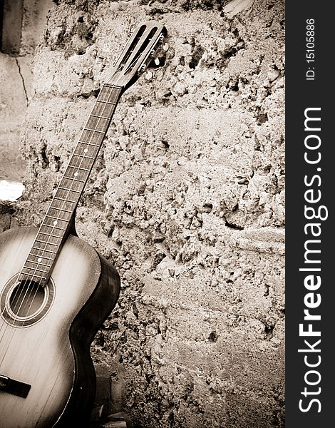 Sepia image of guitar near steps. Sepia image of guitar near steps