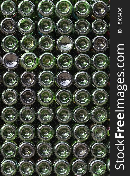 Many green glass wine bottles