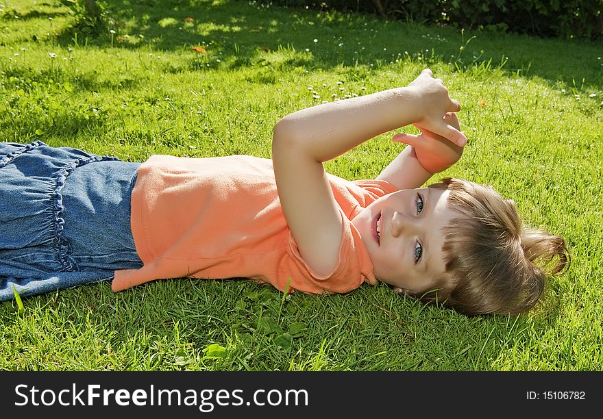 Little girl ( 3 years old ) resting in the garden. Little girl ( 3 years old ) resting in the garden