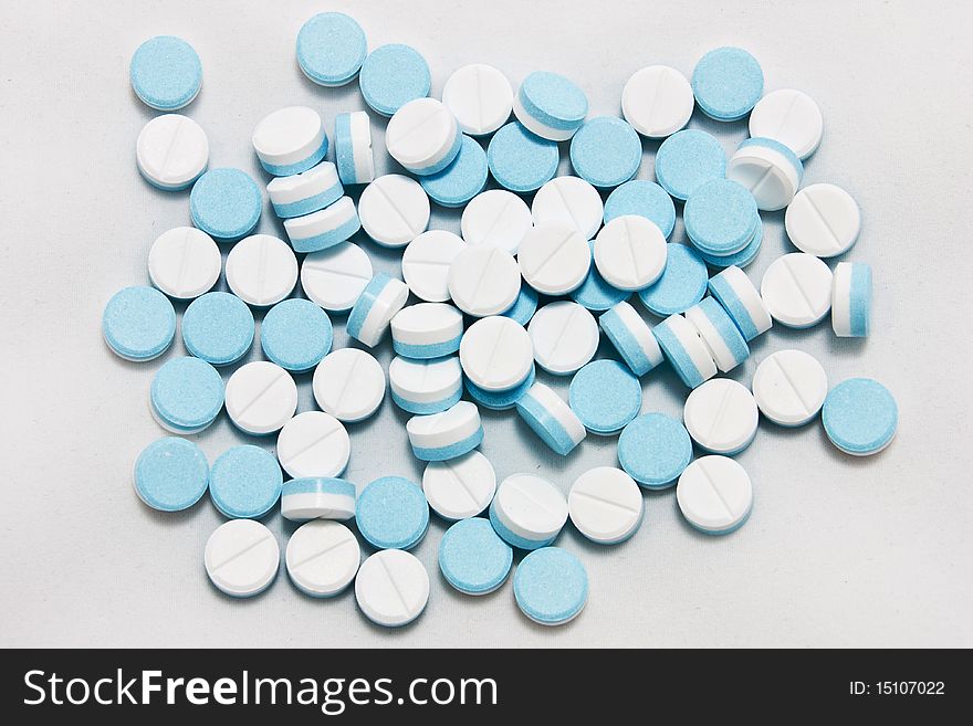 White and blue paracetamol tablets. White and blue paracetamol tablets