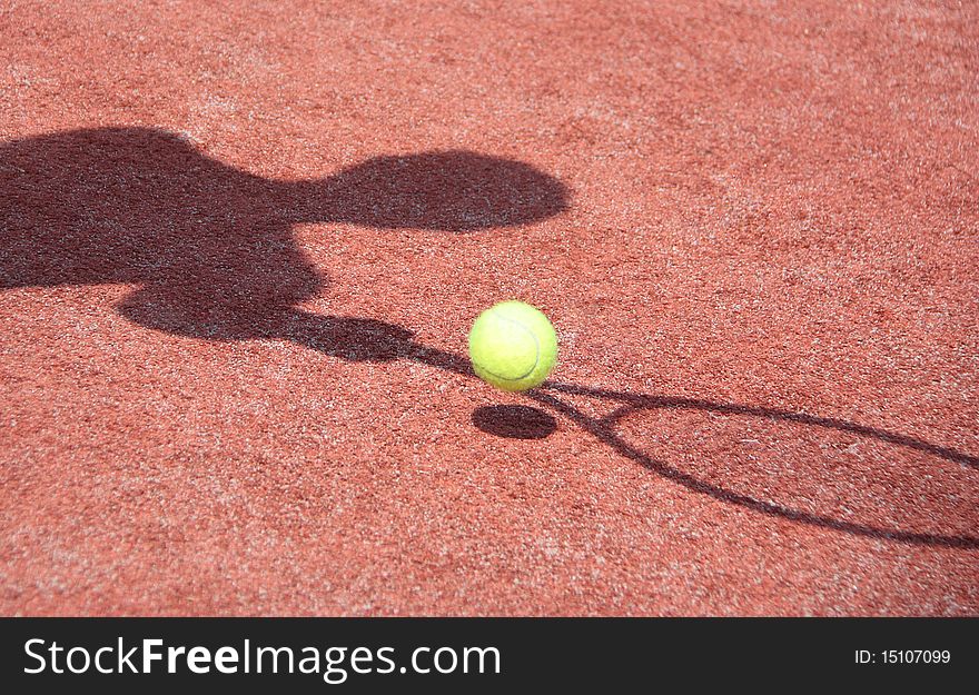 Shadow of the player, when he plays in tennis. Shadow of the player, when he plays in tennis