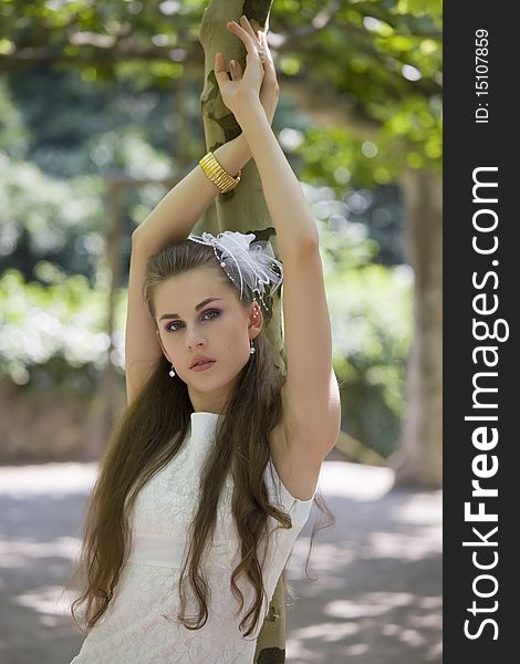 Portrait of young bride in wedding dress posing outdoor. Portrait of young bride in wedding dress posing outdoor