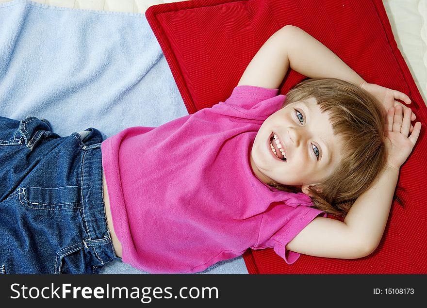 Girl (3 years old) resting on bed. Girl (3 years old) resting on bed