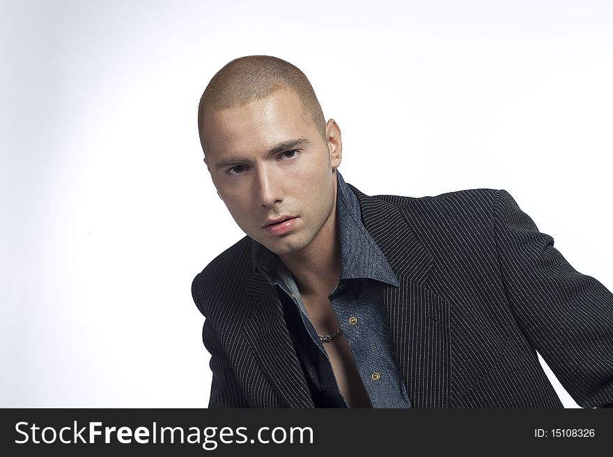 young man posing in a studio. young man posing in a studio