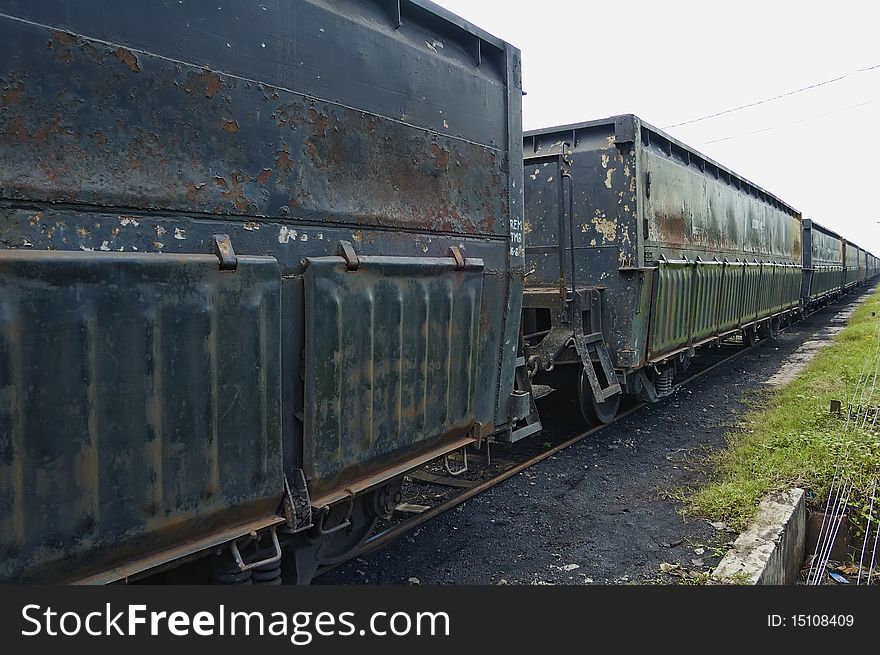 Black iron train car, parking on train depot