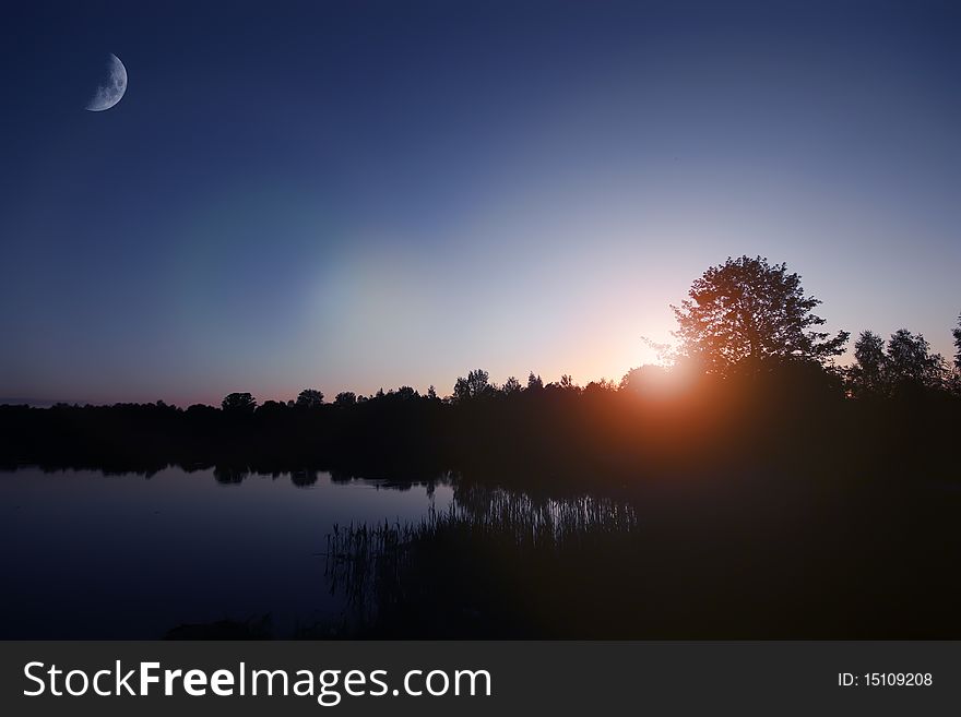 Sun rise lake, early morning, moon and sun. Sun rise lake, early morning, moon and sun