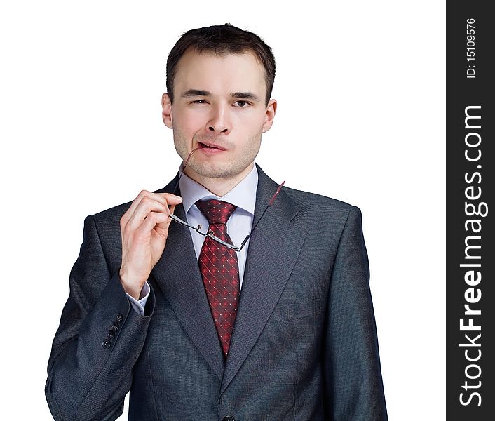 Portrait of young thoughtful businessman in glasses