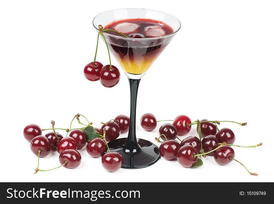 Cocktail with ice and fresh cherries, it is isolated on a white background.