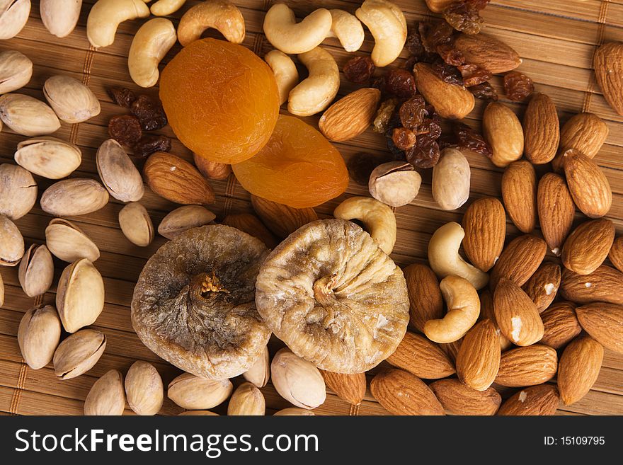 Nuts, fig and dried apricots still life