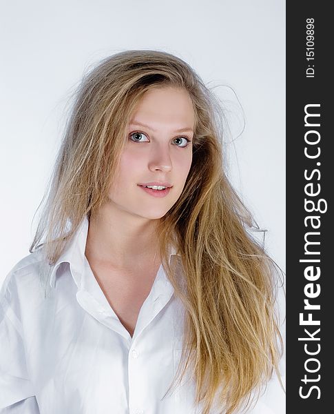 Portrait of an attractive young woman with shaggy hair. Portrait of an attractive young woman with shaggy hair