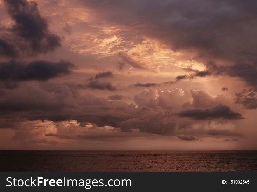 Sunset sky on the Carribean Sea at Cuba, red clouds and sea skyline. Sunset sky on the Carribean Sea at Cuba, red clouds and sea skyline