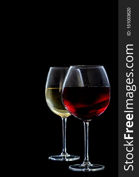 Two Wine glasses on blac kcopy space. Two Wine glasses on blac kcopy space