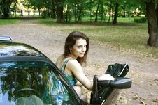 The Beautiful Girl Is Sitting In The Car Royalty Free Stock Photo