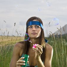 Thoughtful Woman Blowing Soap Bubbles Royalty Free Stock Image Thoughtful Woman Blowing Soap Bubbles Royalty Free Stock Image