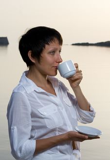 Young Woman Meets Sunrise Drinking Morning Coffee Stock Image