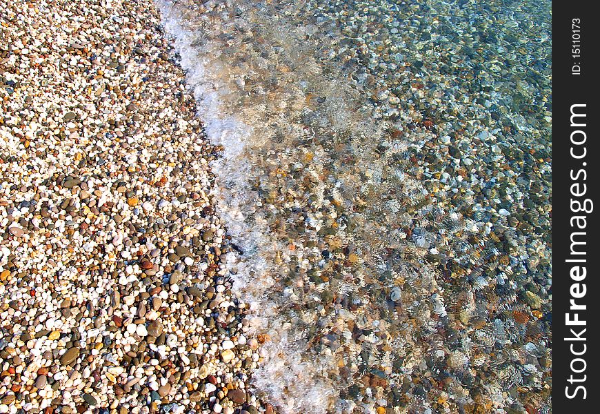 Bright Pebble Beach And Water, Crimea, Ukraine