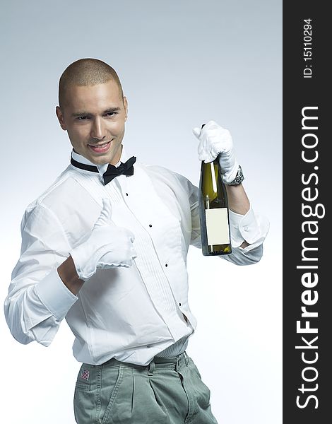 Cool wine waiter holding a bottle of white wine. Cool wine waiter holding a bottle of white wine