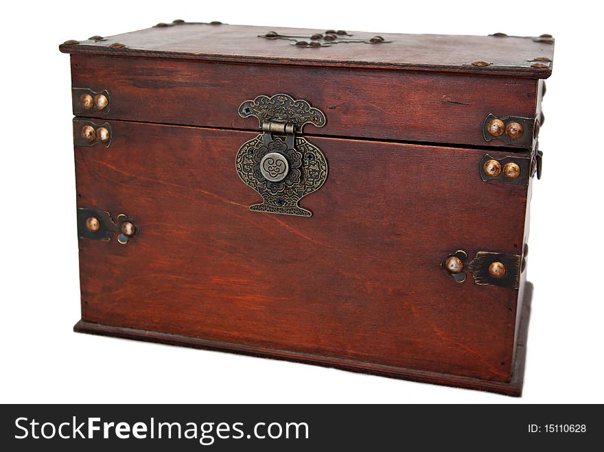 An old wooden jewelery box with metal buckle on a white background