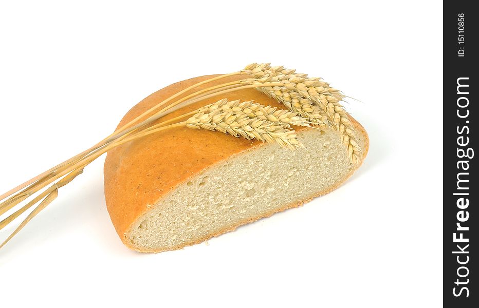 Bread and wheat on a white background. Bread and wheat on a white background