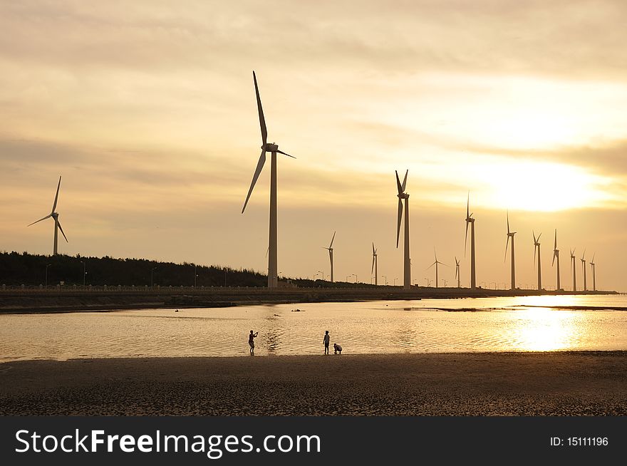 A golden sunset at the wind-power station. A golden sunset at the wind-power station