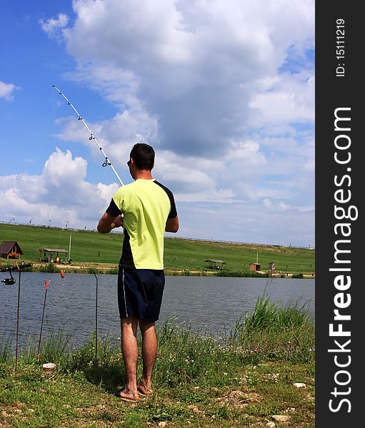 Young boy fishing on a lake. Young boy fishing on a lake