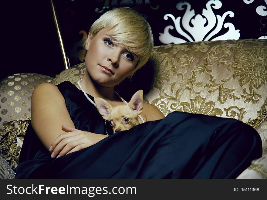 Girl in luxury interior with chihuahua