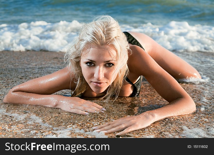 Beauty woman on sea under sky