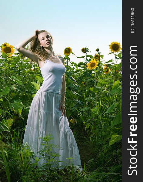 Beauty woman in sunflower field