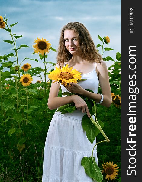 Beauty woman in sunflower field