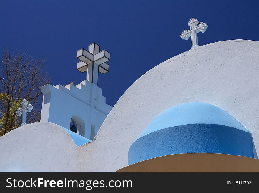 Greek church under blue sky in summer