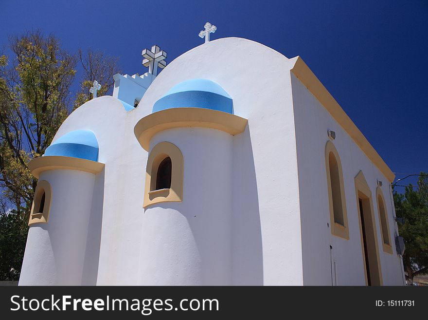 Greek church in summer under blue sky